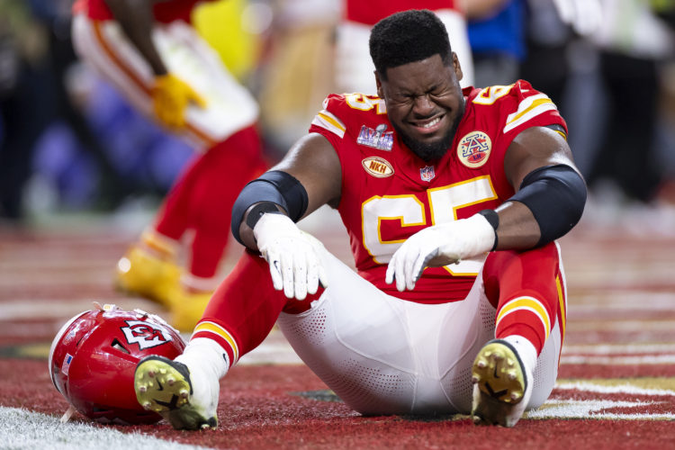 LAS VEGAS, NEVADA - FEBRUARY 11: Trey Smith #65 of the Kansas City Chiefs reacts after winning Super Bowl LVIII against the San Francisco 49ers at ...