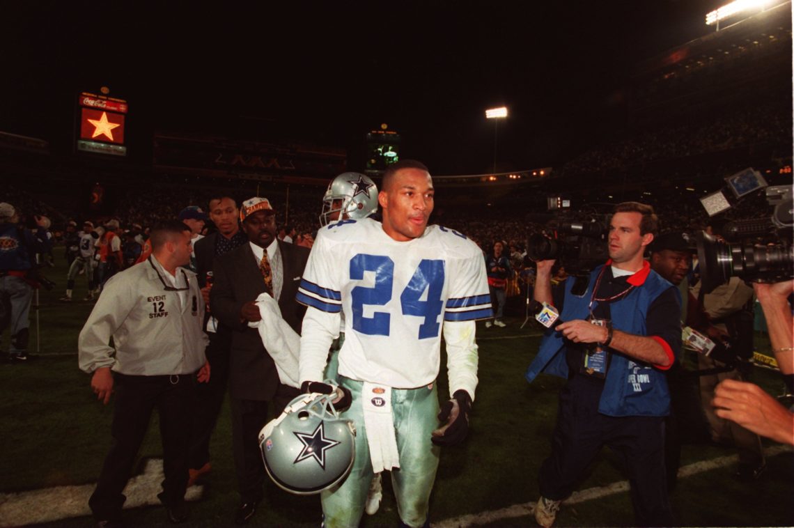 28 Jan 1996:  Cornerback Larry Brown of the Dallas Cowboys is swarmed by the media following the Cowboys 27-17 Super Bowl XXX victory over the Pitt...