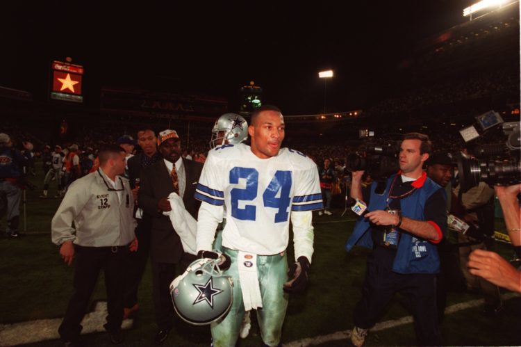 28 Jan 1996:  Cornerback Larry Brown of the Dallas Cowboys is swarmed by the media following the Cowboys 27-17 Super Bowl XXX victory over the Pitt...
